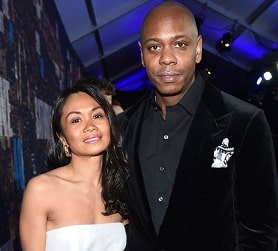 A picture of Dave Chappelle with his wife, Elaine Chappelle.